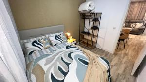a bedroom with a bed and a living room at Villamadrid Home in Madrid