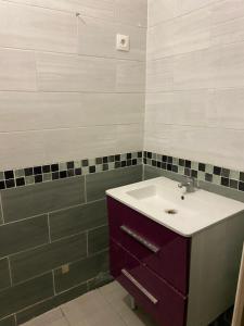 a bathroom with a sink and a shower at Home stay Spacious room in Massy