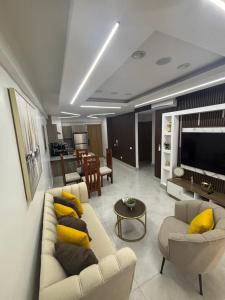 a living room with two couches and a television at The Perfect Place to be in Boca Chica
