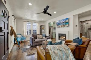 a living room with a couch and a fireplace at Southern Charm - Near Main With Hot Tub in Fredericksburg