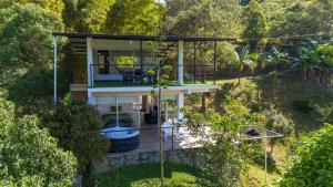 an aerial view of a house in the forest at Altavista Tinyhouse in Macanal
