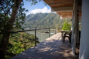 a balcony of a house with a view of a mountain at Altavista Tinyhouse in Macanal