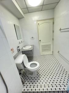a bathroom with a toilet and a sink at Bts studio rooms in Bangna
