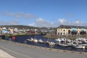 a bunch of boats are docked in a harbor at Stunning Seafront Apartment in Aberystwyth