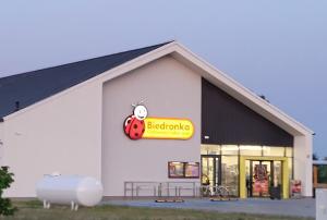 a building with a ladybug sign on it at Cabana Ińsko-domek 20 metrów od plaży in Ińsko +22 photos