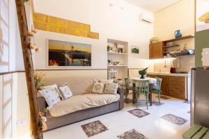 a living room with a couch and a table at La Culla di Adeodata in Marsala