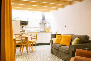 a living room with a couch and a table at Apartamentos Princesa Hayla in Caravaca de la Cruz