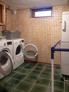 a laundry room with a washing machine in it at Ferienhaus 76 in Freudenstadt