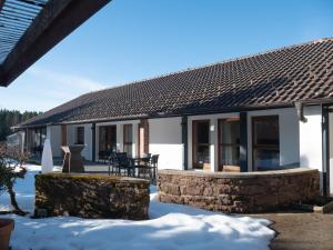 a house with snow in front of it at Ferienhaus 76 in Freudenstadt +23 photos