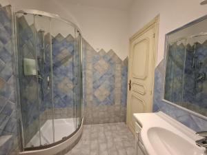 a bathroom with a shower and a sink at Da Ghjuannedda in Arzachena