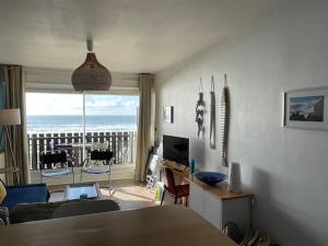 a living room with a view of the ocean at Ocean View Oceanide in Lacanau-Océan