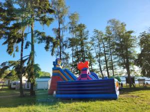 a group of inflatable slides in a park at Cabana Ińsko-domek 20 metrów od plaży in Ińsko