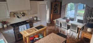 an overhead view of a kitchen with a stove top oven at Rockleigh House in Corsham