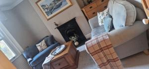 an overhead view of a living room with a couch and a fireplace at Rockleigh House in Corsham