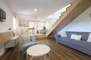 a living room with a couch and a table at Quinta do Giz in Baião