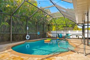 a pool in a greenhouse with a swimming pool at The Mimosa House in Sarasota