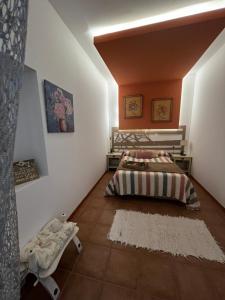 a bedroom with two beds and a rug at Salamandra in Carboneras