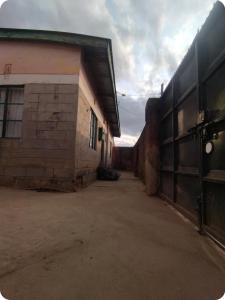 an empty alley next to a building at Jenka homes in Kitui