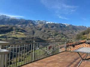 a balcony with a table and a view of a mountain at El Sueño de Celia 1 in Doña Juandi