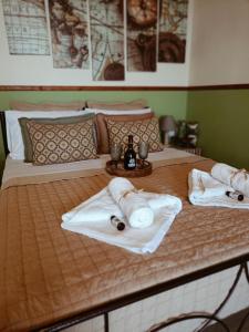a bed with towels and bottles on it at Sofilia view house in Argilia