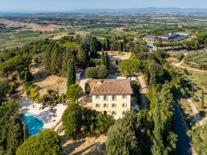 an aerial view of a house with a river and trees at Nobilis Charme Relais in Montepulciano