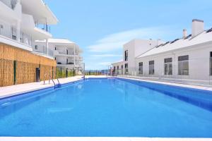 a large swimming pool in the middle of a building at Luxury Apartment Higueron in Fuengirola