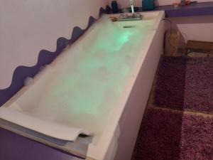 a bath tub filled with water in a room at Olystic bed and breakfast in Seriate +6 photos