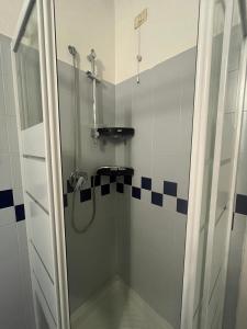 a shower with a glass door in a bathroom at Garden Prina-250mt Clinica Zucchi-Monza in Monza +19 photos
