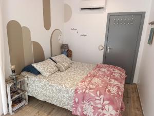 a small bedroom with a bed and a door at Gîte CANTO AZUL in Casal da Carreira +95 photos