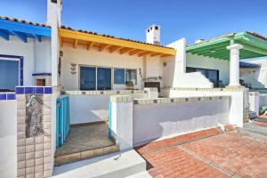 a house with a gate and a fence at Cozy Beachfront Condo Las Olas II 10 in Puerto Peñasco