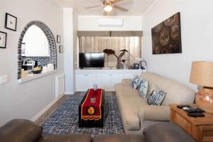 a living room with a couch and a table at Cozy Beachfront Condo Las Olas II 10 in Puerto Peñasco