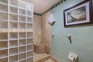 a bathroom with a shower with glass block walls at Charming Condo in Great Location Pinacate 412 in Puerto Peñasco