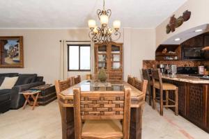 a dining room and living room with a table and chairs at Unique Oceanfront with Epic Sunsets Pinacate 202 in Puerto Peñasco +37 photos