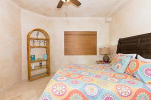 a bedroom with a bed and a ceiling fan at Charming Cozy Condo Great View Pinacate 404 in Puerto Peñasco