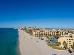 an aerial view of a beach with buildings and the ocean at Gorgeous Third-Level Condo Princesa D-308 in Puerto Peñasco