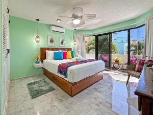 a bedroom with a bed and a balcony at Casa Cuatro Estaciones in Puerto Morelos +131 photos