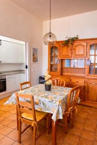 a kitchen with a dining room table and chairs at Cala Paradiso in Tossa de Mar