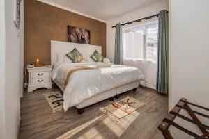a bedroom with a large bed and a window at Namclassics in Langstrand