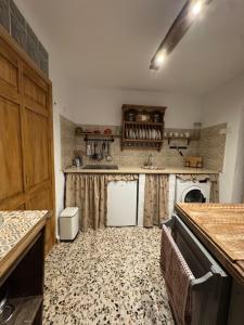 a kitchen with a sink and a counter top at Mil House in Cómpeta