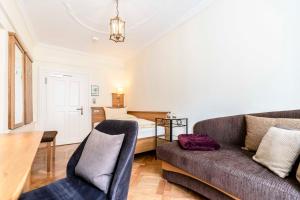 a living room with a couch and a bed at Alte Post in Lindau +30 photos