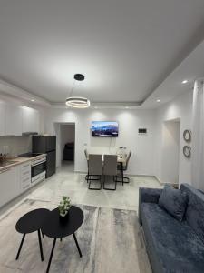 a living room with a couch and a table at Peaceful House in Përmet +12 photos