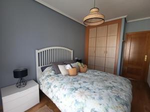 a bedroom with a large bed with flowers on it at Casa María House in Zubiri