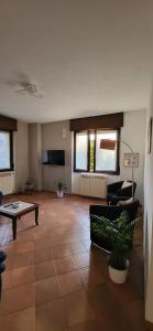 a large living room with a couch and a table at Casa Leonardo in Tirano