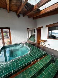 a room with a jacuzzi tub in a house at Rustic Escape Between Valle & Avándaro in Valle de Bravo