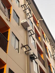a building with a hose attached to the side of it at Casa Selenó in Batangas City