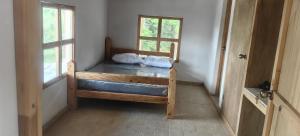 a bedroom with a bunk bed with two pillows on it at La Casa de Blue in Guarne