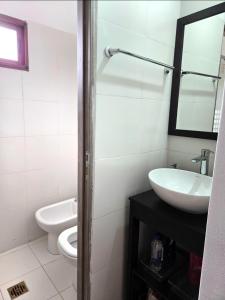 a bathroom with a sink and a toilet at Cesar - Caesars in La Rioja