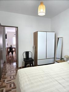 a bedroom with a bed and a chair and a table at Cesar - Caesars in La Rioja