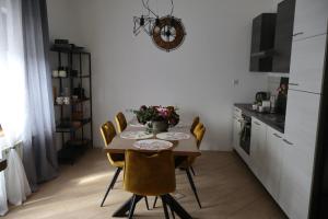 a dining room with a table and chairs in a kitchen at MonteMare Holiday home in Lič