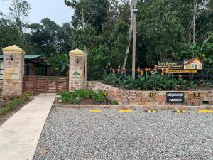 a garden with a fence and a train in the background at Condominio Entre Bosques Cabaña 9 in Piedecuesta +2 photos